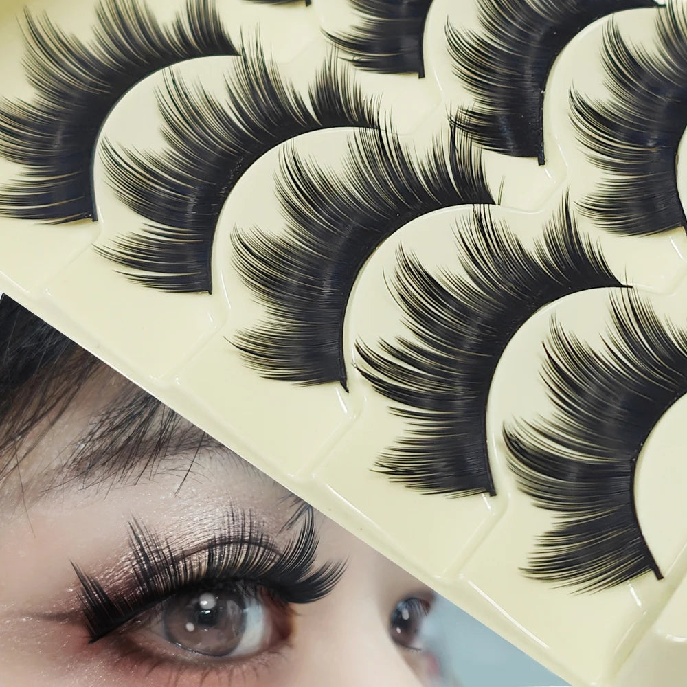 Close-up of a person's eye with Paris Cat Eye false eyelashes applied, showing the long and thick strip lashes.