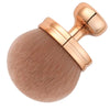 A large, round makeup brush with a gold-toned handle and natural bronze bristles.