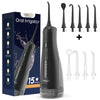A black momwell oral irrigator device shown with various tips and accessories.