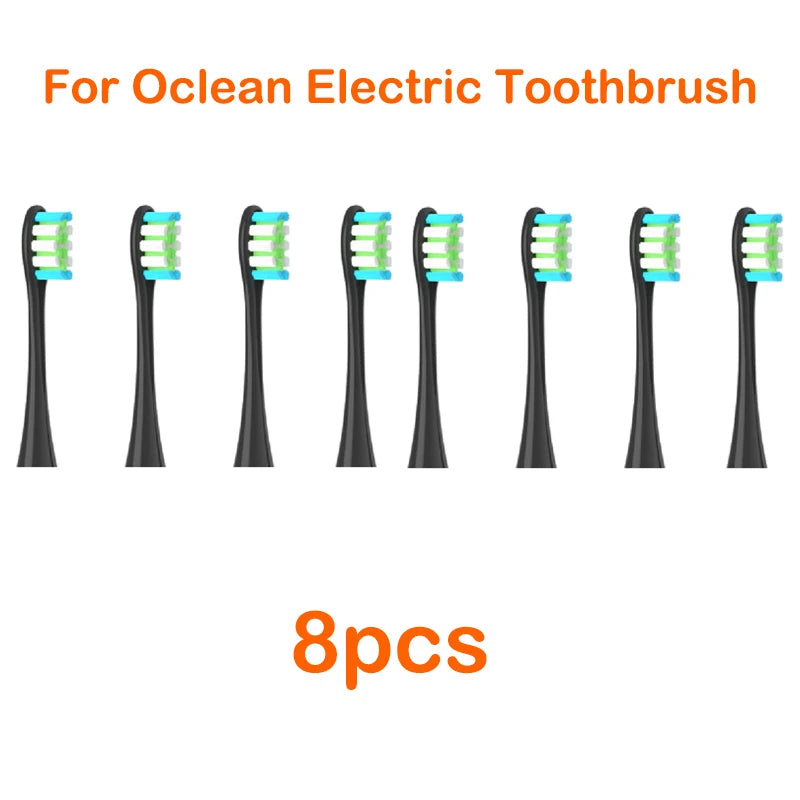 Eight replacement brush heads for an Ocean electric toothbrush are displayed side by side.