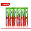 A pack of six Colgate soft bristle toothbrushes in green packaging.