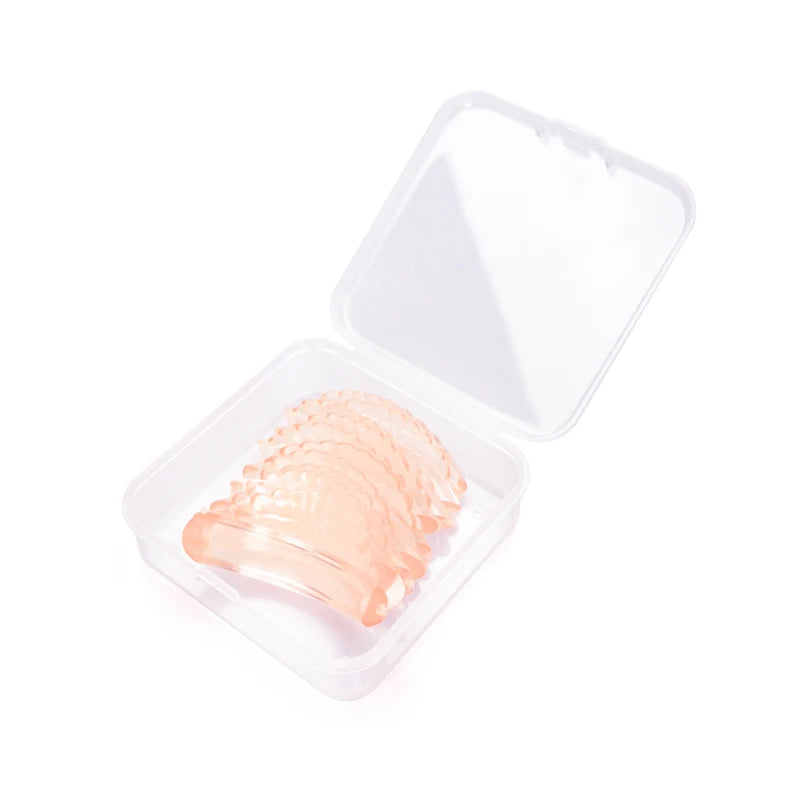 Conteneur en plastique transparent contenant des tampons de recourbeurs en silicone pour les lift de cils