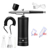 A portable airbrush kit for nail art and craft painting showing the airbrush, tubing, and various paint colors.