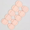 A cluster of pink latex-free finger puffs for makeup application