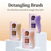 A set of purple and beige detangling brushes for smooth and tangle-free hair displayed on white stands.