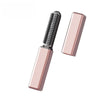 A pink portable wireless hair comb and curling iron tool.