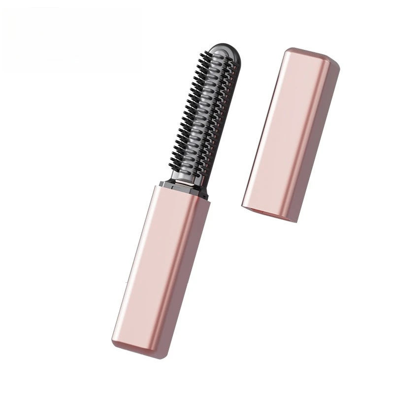 A pink portable wireless hair comb and curling iron tool.
