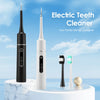 A black and white electric tooth cleaner is displayed on a marble stand with a toothbrush and a cleaning brush.