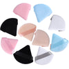 A collection of pink, blue, and black makeup sponge puffs shown from various angles.