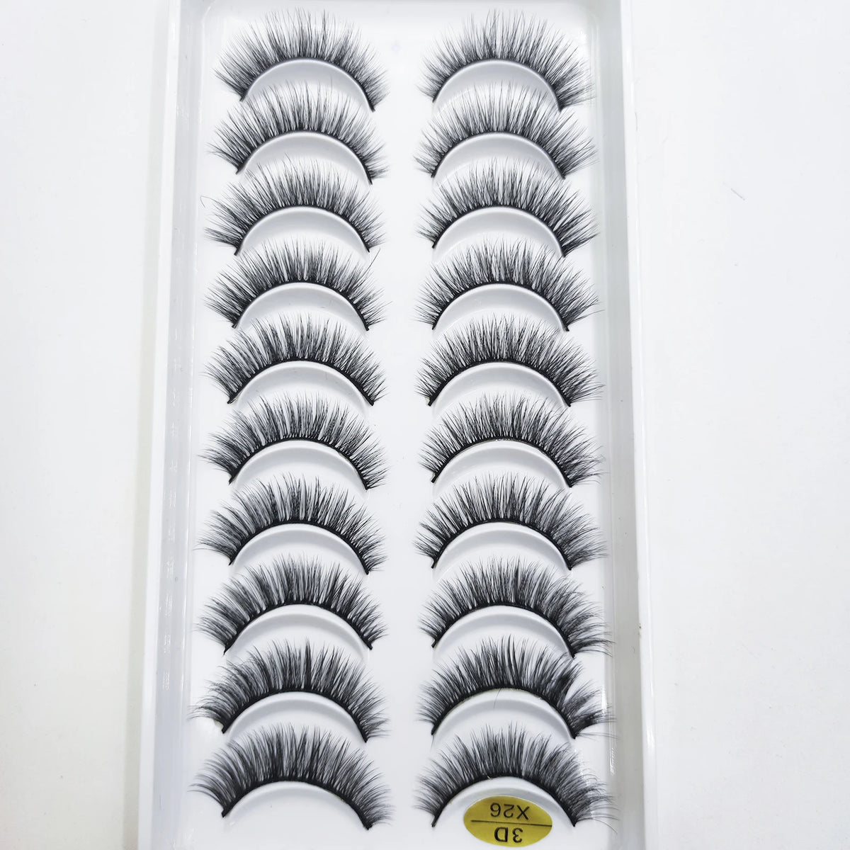 A tray of natural 3D mink false eyelashes displayed in a clear plastic packaging.
