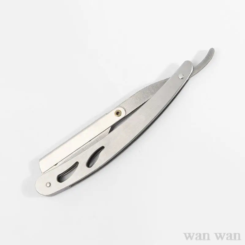 A stainless steel folding shaving razor set with a silver handle and blade visible.