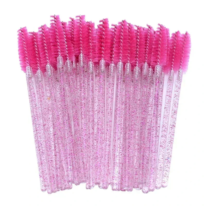 A set of pink disposable eyelash and eyebrow brushes