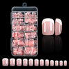A clear plastic container holds a set of nude pink press-on nails with white French tips, displayed next to individual nails.