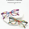 A set of colorful printed picture frames featuring retro cat eye style glasses displayed on white foam blocks.