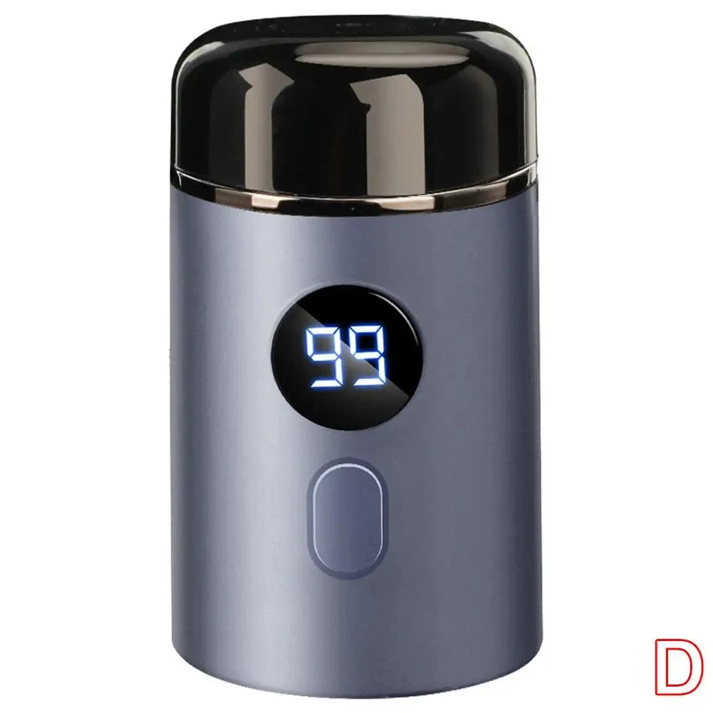 A close-up view of a silver electric shaver with a black top and a digital display showing 99.