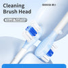 A close-up view of a cleaning brush head for a sonic toothbrush, showing blue and white bristles on a white handle.