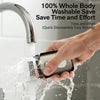 A hand is using a portable electric foil shaver under running water from a faucet.