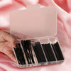 A hand holds an open clear storage case containing a set of 80 black makeup brushes.