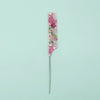 A pink and green anti-static rat tail comb with a metal handle.