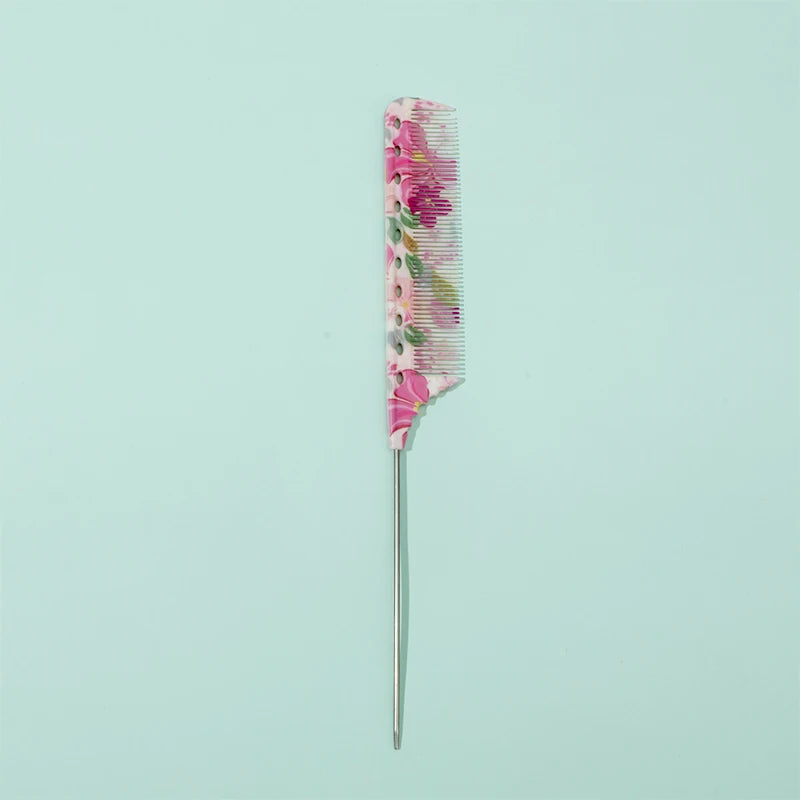 A pink and green anti-static rat tail comb with a metal handle.