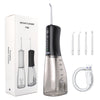Portables Wasser-Flosser-Gerät in Schwarz und klarem Glas mit Komponenten und Ladekabel.