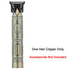 A vintage cordless hair clipper with a metallic body and a protective guard visible.