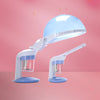 A white facial and hair steamer with a light blue dome head is shown against a pink background.