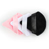 A set of three reusable velvet powder puffs in pink, white, and black.