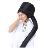 A woman wearing a black adjustable hair drying cap for salon or home use.