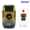 A black and gold Kemei electric shaver with replacement blades and a shaving head shown on a white background.
