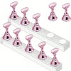 A set of pink magnetic nail art display stands arranged on a white rectangular stand.