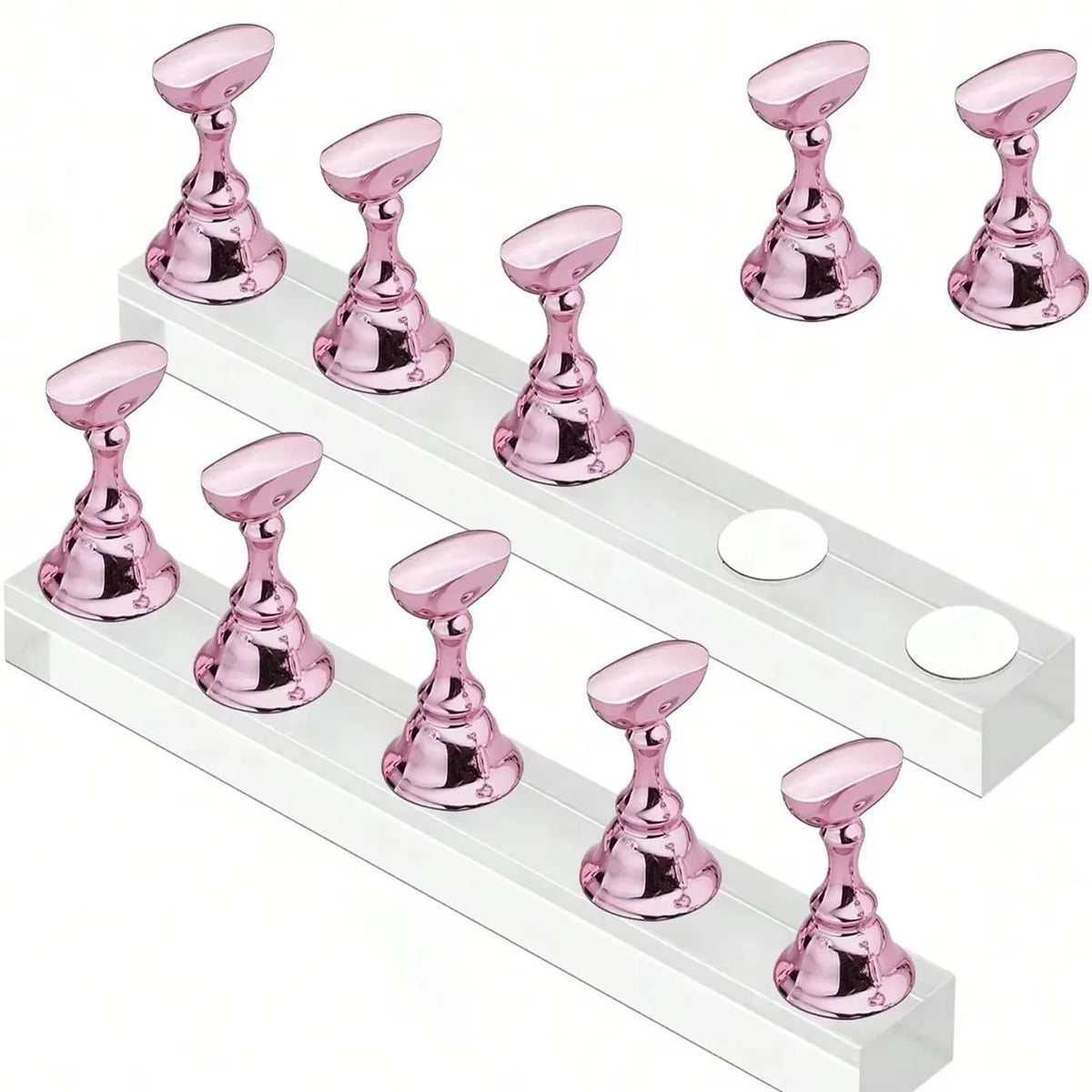 A set of pink magnetic nail art display stands arranged on a white rectangular stand.