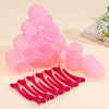 A set of pink silicone self-grip hair rollers for creating heatless curls and volume.