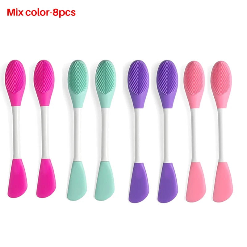 A set of eight silicone facial brushes in various colors including pink, purple, and green for exfoliation