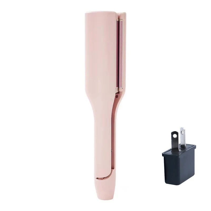A pink professional ceramic hair curling iron with a black adapter.