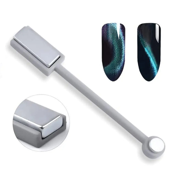 A nail magnet tool with a silver handle and gradient cat eye nail tips in green and black.