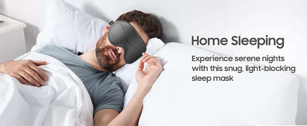 A man sleeping comfortably with a black snug light-blocking sleep mask on, demonstrating home sleeping.