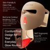 A close-up view of a beige silicone face mask designed for a glow routine with features like a breathing zone and ergonomic f