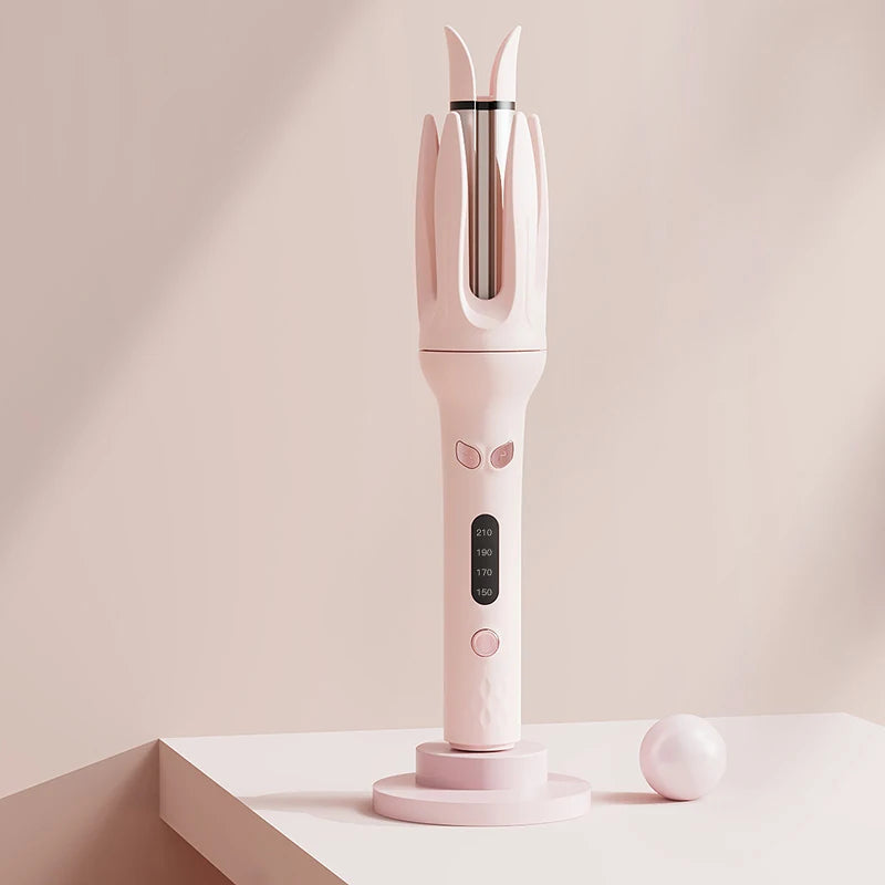 A pink automatic ceramic hair curler with negative ions resting on a white surface.