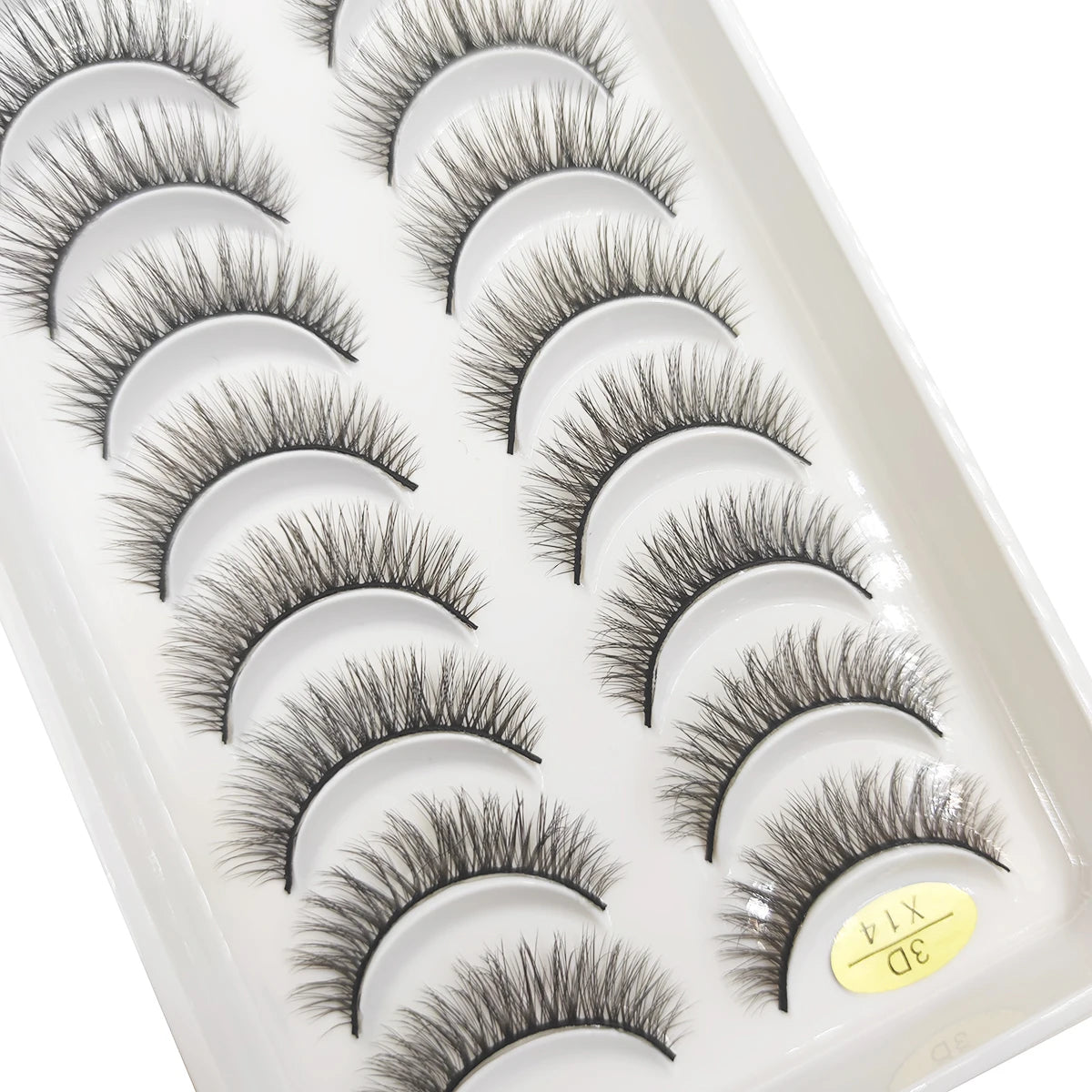 A tray of natural 3D mink false eyelashes displayed in a white plastic container.