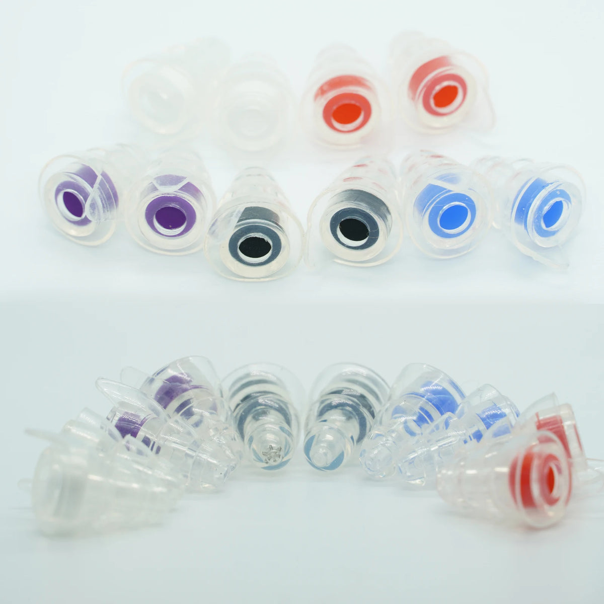 A collection of high fidelity silicone earplugs in various colors including red, blue, purple, and black, displayed in a whit