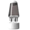A clear glass bottle with volume markings and a ball-tip applicator for precision scalp oil massage.