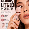 A woman is using a pink electric heated eyelash curler on her eye, demonstrating the clamp, lift & set in one step feature.