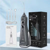 A black portable oral irrigator device is shown next to its packaging box and accessories.