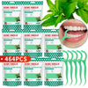 Pack of 15 dental floss picks in mint flavor with a green portable case and fresh mint leaves