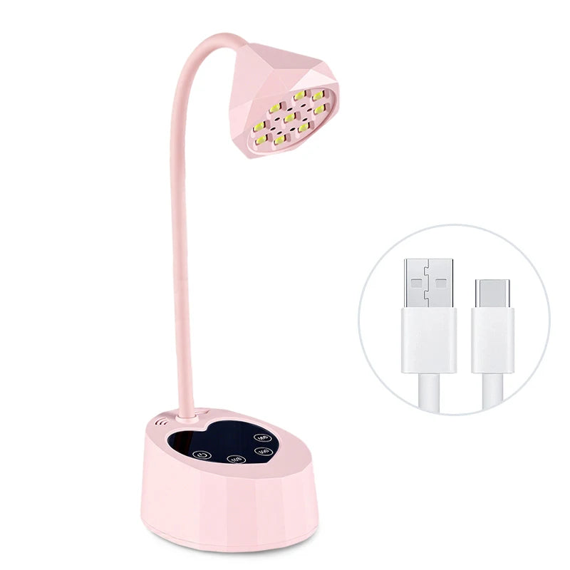 A pink professional UV LED nail lamp with a flexible arm and a light panel.