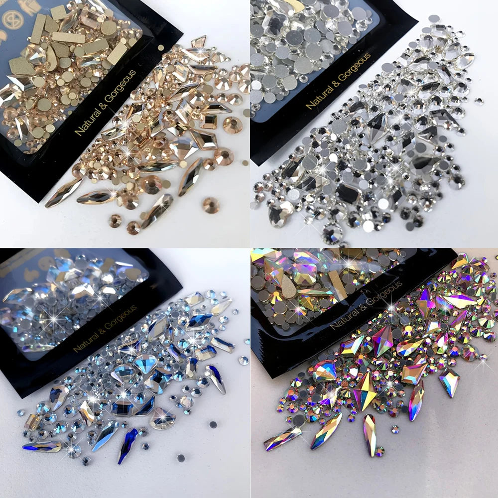 A collection of mixed glass rhinestones in various sizes and colors, including silver, gold, and iridescent shades.