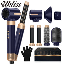 A collection of Ukliss hair styling tools including a dryer brush, curling iron, and straightener set.