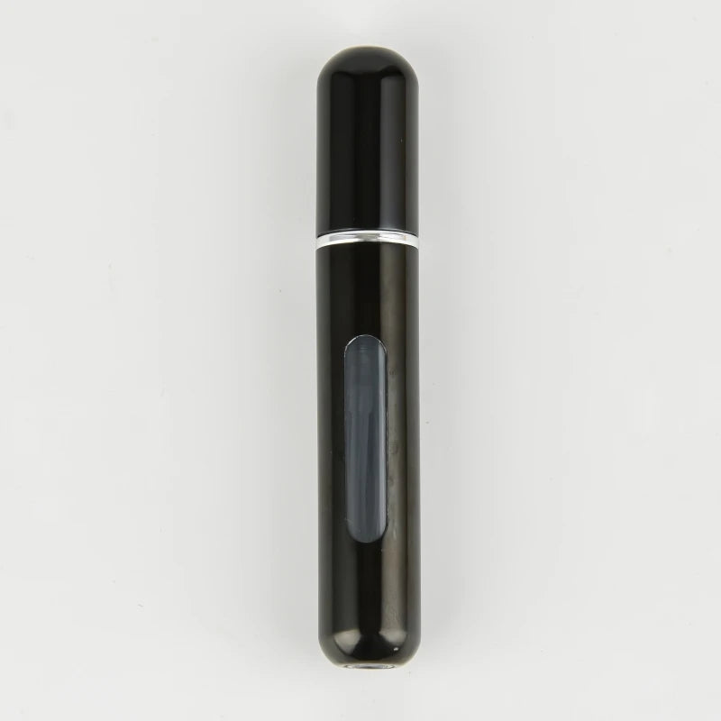 A sleek, black portable refillable perfume bottle with a silver band and a translucent inner section.