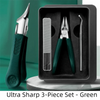 A green 3-piece set of manicure tools including a nail clipper, cuticle nippers, and a metal pick, displayed in a black case.